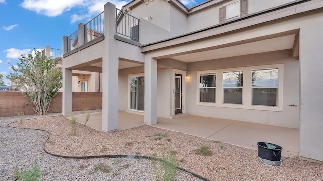 3536 Clear Creek Pl, Rio Rancho, NM 87144 - rear view of property with a balcony, stucco siding, and a patio area