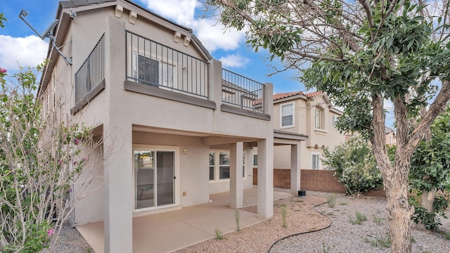 3536 Clear Creek Pl, Rio Rancho, NM 87144 - rear view of house featuring a balcony, stucco siding, and a patio