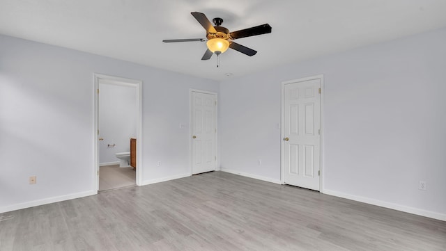 3536 Clear Creek Pl, Rio Rancho, NM 87144 - unfurnished bedroom with wood finished floors, connected bathroom, and a ceiling fan