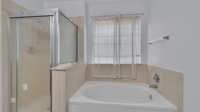 3536 Clear Creek Pl, Rio Rancho, NM 87144 - full bathroom with a shower stall, a garden tub, and plenty of natural light
