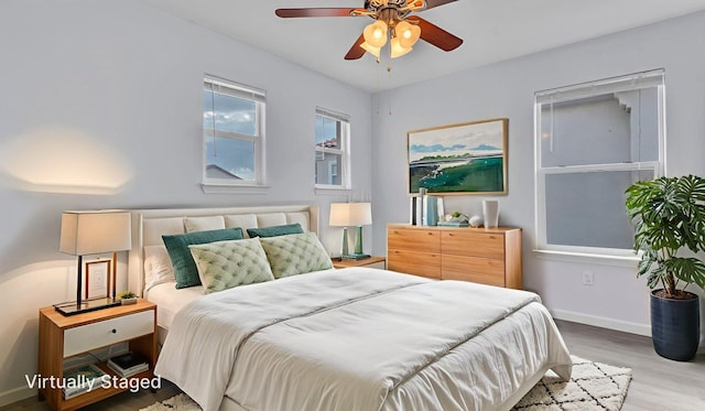 3536 Clear Creek Pl, Rio Rancho, NM 87144 - bedroom with wood finished floors and baseboards