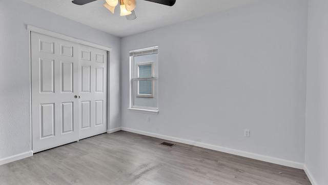 3536 Clear Creek Pl, Rio Rancho, NM 87144 - unfurnished bedroom featuring a closet, wood finished floors, and a ceiling fan