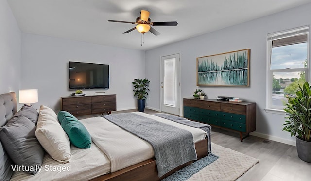 3536 Clear Creek Pl, Rio Rancho, NM 87144 - bedroom with wood finished floors and a ceiling fan