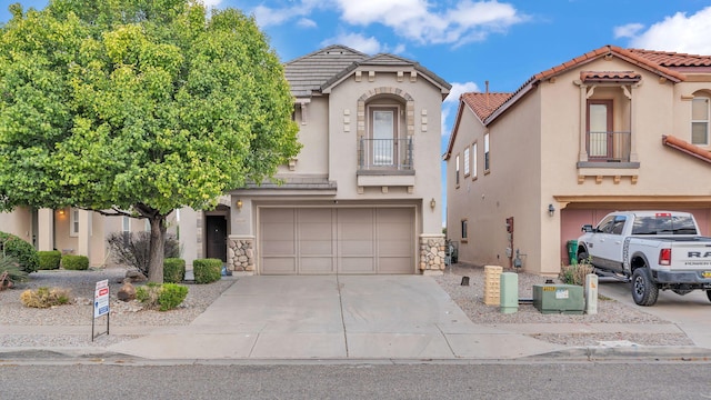 3536 Clear Creek Pl, Rio Rancho, NM 87144 - mediterranean / spanish house with a garage, driveway, a balcony, stucco siding, and a tiled roof