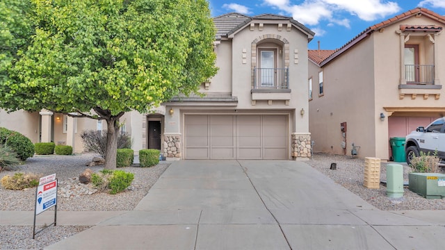 3536 Clear Creek Pl, Rio Rancho, NM 87144 - view of front of property with a balcony, concrete driveway, stucco siding, and a tiled roof
