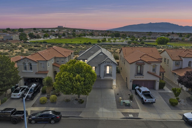 3536 Clear Creek Pl, Rio Rancho, NM 87144 - aerial view at dusk of a residential view and a mountain view