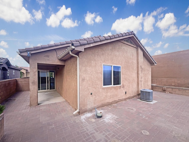 1225 La Fonda St, Bernalillo, NM 87004 - back of property with stucco siding, a patio area, and a fenced backyard
