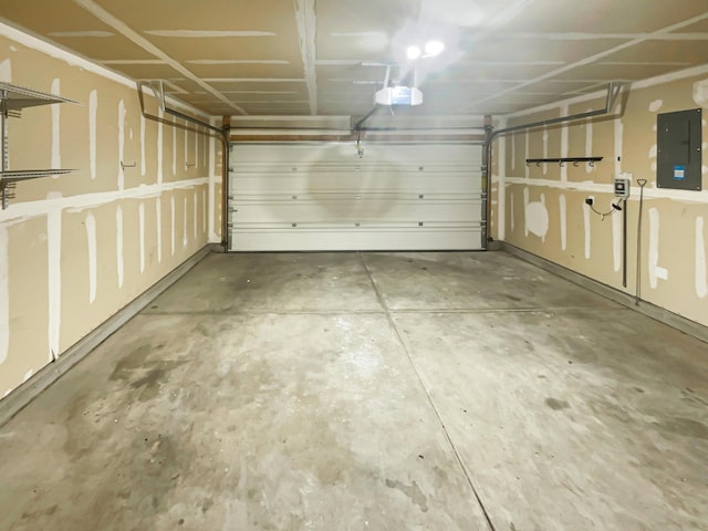 1225 La Fonda St, Bernalillo, NM 87004 - garage with electric panel and a garage door opener