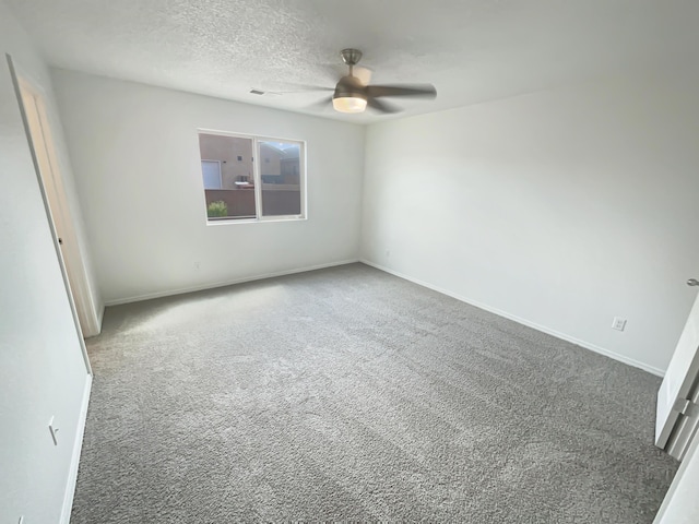 1225 La Fonda St, Bernalillo, NM 87004 - carpeted spare room with a ceiling fan and a textured ceiling