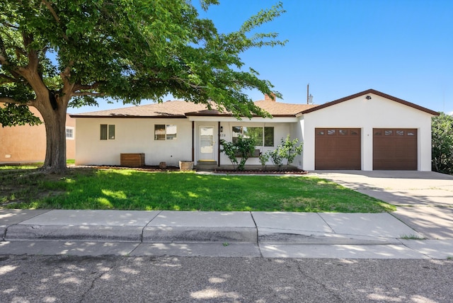 9638 Morrow Ave NE, Albuquerque, NM 87112 - ranch-style house featuring a front lawn, stucco siding, driveway, and a garage