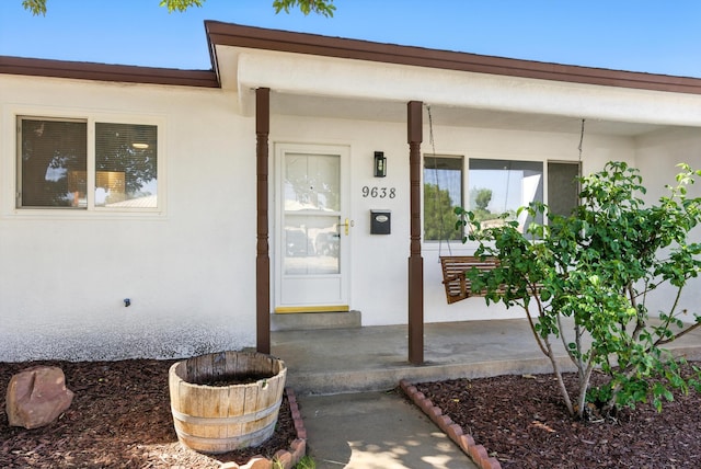 9638 Morrow Ave NE, Albuquerque, NM 87112 - property entrance with stucco siding and a porch