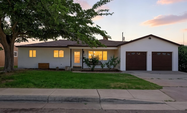 9638 Morrow Ave NE, Albuquerque, NM 87112 - ranch-style home featuring stucco siding, an attached garage, concrete driveway, and a lawn