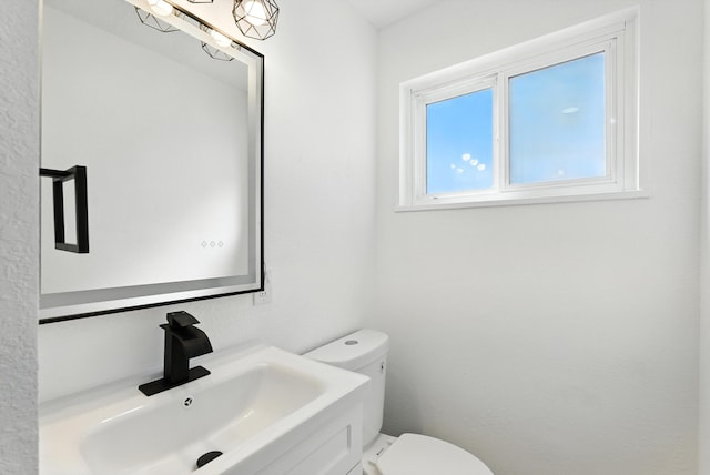 9638 Morrow Ave NE, Albuquerque, NM 87112 - bathroom featuring toilet and vanity