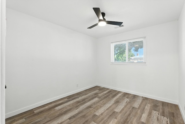 9638 Morrow Ave NE, Albuquerque, NM 87112 - spare room featuring wood finished floors and a ceiling fan