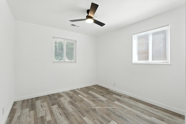 9638 Morrow Ave NE, Albuquerque, NM 87112 - unfurnished room with wood finished floors and ceiling fan
