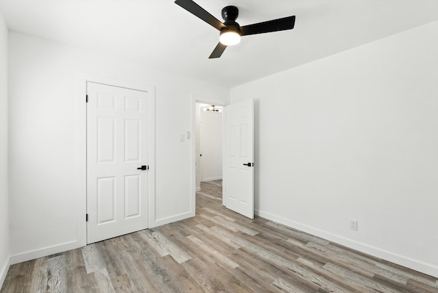 9638 Morrow Ave NE, Albuquerque, NM 87112 - unfurnished bedroom featuring wood finished floors and ceiling fan