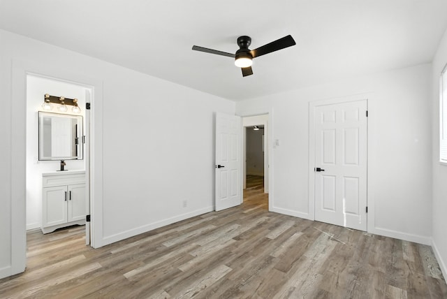 9638 Morrow Ave NE, Albuquerque, NM 87112 - unfurnished bedroom featuring light wood-type flooring, connected bathroom, and a ceiling fan