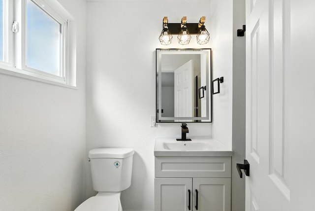 9638 Morrow Ave NE, Albuquerque, NM 87112 - half bathroom featuring toilet and vanity