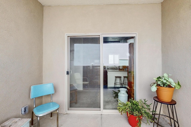 6383 Gannett Dr NE, Rio Rancho, NM 87144 - view of exterior entry with stucco siding