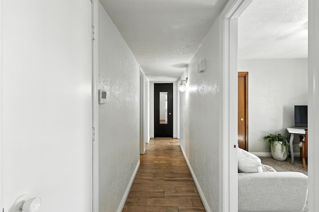 120 Itasca Rd SE, Rio Rancho, NM 87124 - corridor featuring a textured wall, wood finished floors, and a textured ceiling