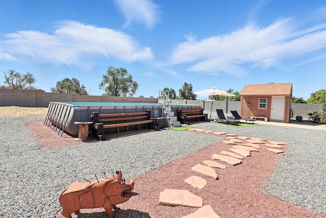 120 Itasca Rd SE, Rio Rancho, NM 87124 - fenced backyard featuring a storage unit and a patio area