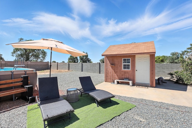 120 Itasca Rd SE, Rio Rancho, NM 87124 - fenced backyard featuring a storage shed and a patio area