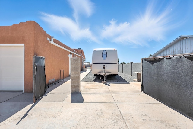 120 Itasca Rd SE, Rio Rancho, NM 87124 - view of patio featuring a garage