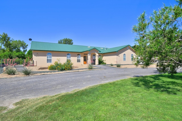 2 Partridge Ct, Peralta, NM 87042 - ranch-style house with driveway, stucco siding, and a metal roof