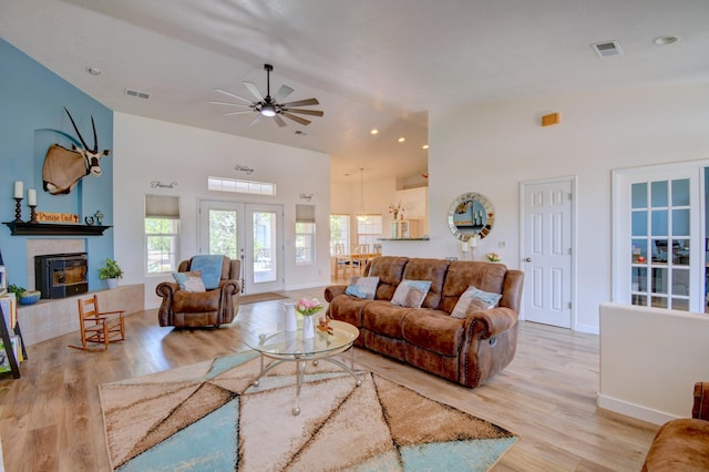 2 Partridge Ct, Peralta, NM 87042 - living room featuring wood finished floors, ceiling fan, a glass covered fireplace, high vaulted ceiling, and recessed lighting