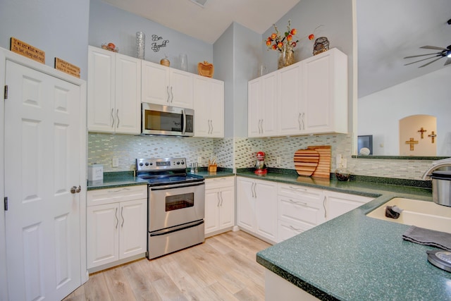 2 Partridge Ct, Peralta, NM 87042 - kitchen with appliances with stainless steel finishes, white cabinets, and light wood finished floors