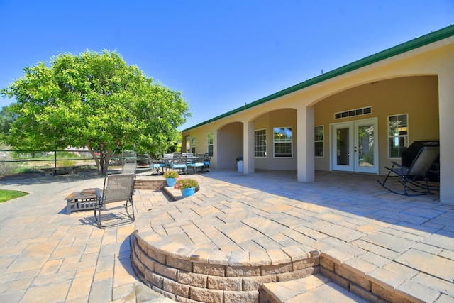 2 Partridge Ct, Peralta, NM 87042 - view of patio / terrace with french doors and an outdoor fire pit