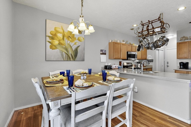 1969 Cortina Loop SE, Albuquerque, NM 87124 - dining area featuring a chandelier, light wood finished floors, recessed lighting, and a textured ceiling