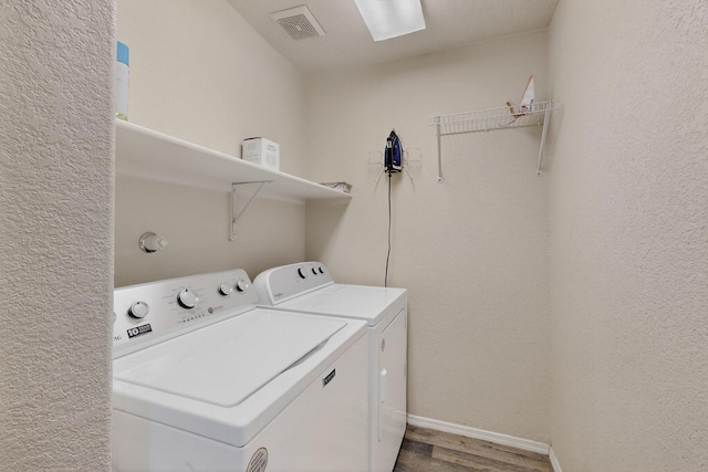 1969 Cortina Loop SE, Albuquerque, NM 87124 - laundry area featuring independent washer and dryer and wood finished floors