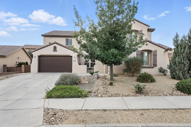 43 Vista Larga Pl NE, Rio Rancho, NM 87124 - mediterranean / spanish house with concrete driveway, stucco siding, a tile roof, and a garage