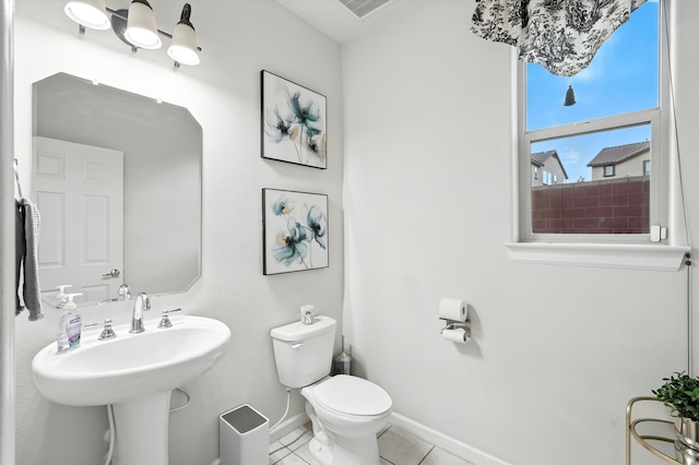 43 Vista Larga Pl NE, Rio Rancho, NM 87124 - bathroom with toilet and tile patterned floors