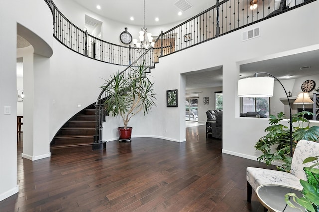43 Vista Larga Pl NE, Rio Rancho, NM 87124 - entrance foyer with hardwood / wood-style floors, stairs, a high ceiling, a chandelier, and recessed lighting
