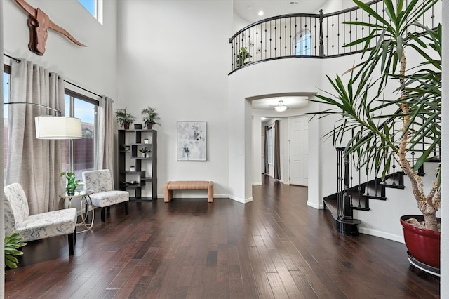 43 Vista Larga Pl NE, Rio Rancho, NM 87124 - foyer entrance with a towering ceiling, hardwood / wood-style floors, and stairway