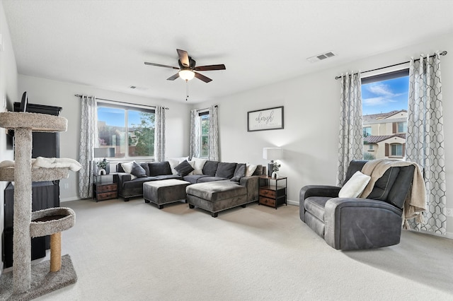 43 Vista Larga Pl NE, Rio Rancho, NM 87124 - carpeted living room featuring ceiling fan and baseboards