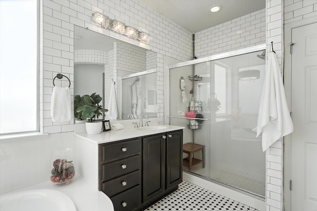 43 Vista Larga Pl NE, Rio Rancho, NM 87124 - bathroom with a shower stall, vanity, a garden tub, and recessed lighting