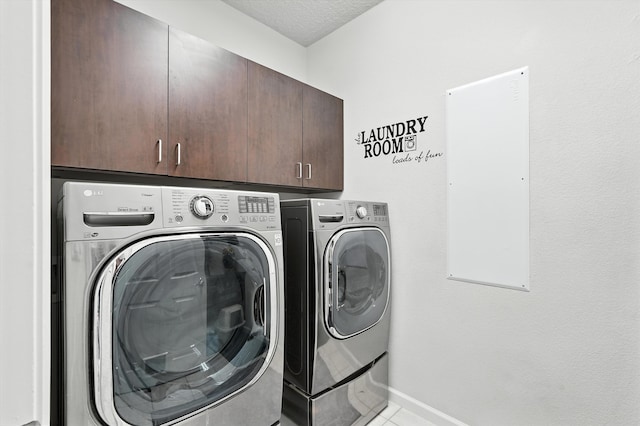 43 Vista Larga Pl NE, Rio Rancho, NM 87124 - laundry room featuring cabinet space, independent washer and dryer, light tile patterned floors, and a textured ceiling