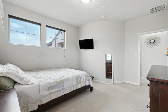 43 Vista Larga Pl NE, Rio Rancho, NM 87124 - bedroom with light colored carpet and a textured ceiling