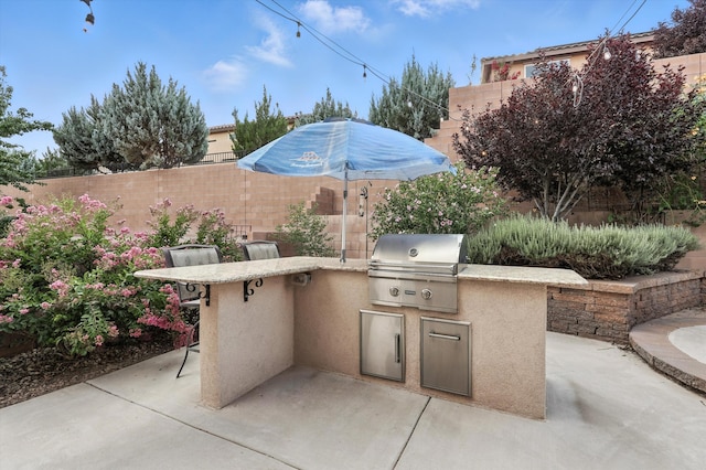43 Vista Larga Pl NE, Rio Rancho, NM 87124 - view of patio / terrace featuring an outdoor kitchen