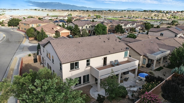 43 Vista Larga Pl NE, Rio Rancho, NM 87124 - aerial perspective of suburban area with a mountainous background