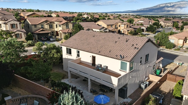 43 Vista Larga Pl NE, Rio Rancho, NM 87124 - aerial perspective of suburban area with a mountainous background