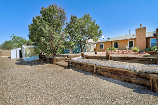 6054 Jack Rabbit Rd NE, Rio Rancho, NM 87144 - view of front facade with a shed