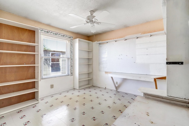 6054 Jack Rabbit Rd NE, Rio Rancho, NM 87144 - spare room featuring tile patterned floors, ceiling fan, and a textured ceiling