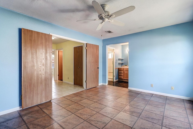 6054 Jack Rabbit Rd NE, Rio Rancho, NM 87144 - empty room with ceiling fan and a textured ceiling