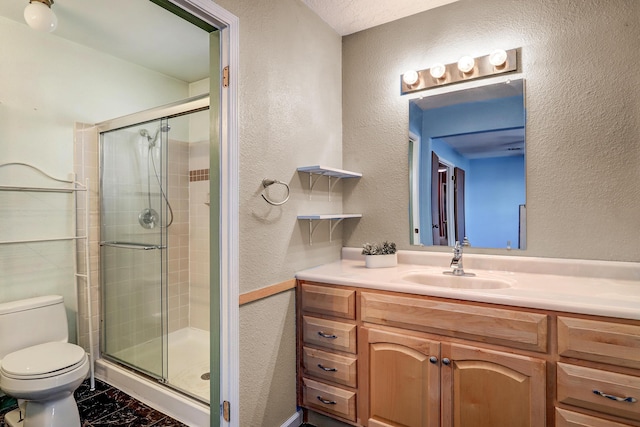 6054 Jack Rabbit Rd NE, Rio Rancho, NM 87144 - bathroom featuring vanity, a textured wall, a shower stall, and marble look tile flooring