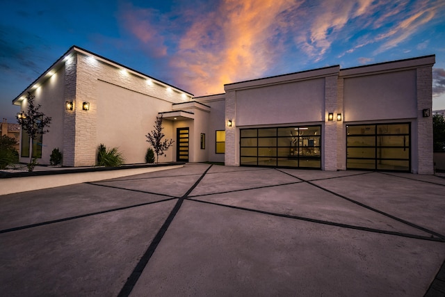 5624 Laredo, Rio Rancho, NM 87144 - contemporary house featuring stucco siding, an attached garage, and concrete driveway