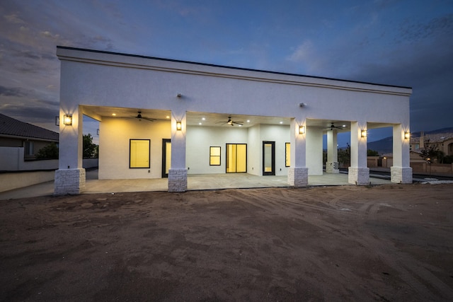 5624 Laredo, Rio Rancho, NM 87144 - back of house featuring a ceiling fan, stucco siding, and a patio area